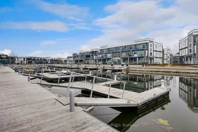 a marina with a bunch of boats in the water at Waterfront Modern Vila in Innisfil