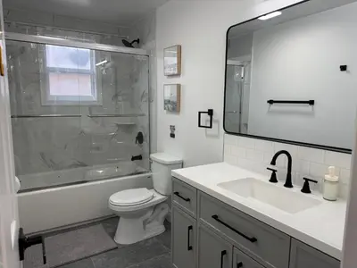a bathroom with a shower and a toilet and a sink at North Barrie !A Stylish and Spacious Private Bedroom with Private Bathroom in Barrie