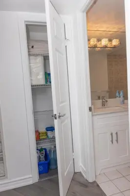 an open door to a bathroom with a sink at PlanURstay - Ideal 2BR & 2 BTH - Near SQ1 Mall in Mississauga