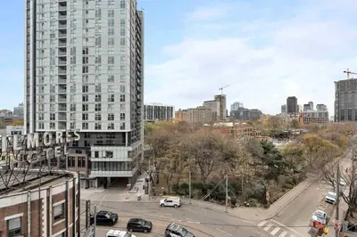 an aerial view of a city with a tall building at Chic 2BR Condo Toronto Core Steps to Eaton Centre in Toronto