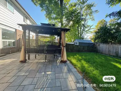a gazebo on a patio in a yard at Quite room finch birchmunt in Toronto