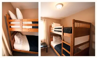 two bunk beds in a room next to each other at Misty Retreat in Niagara Falls