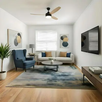 a living room with a couch and a chair at RIVERSIDE STAY in Niagara Falls