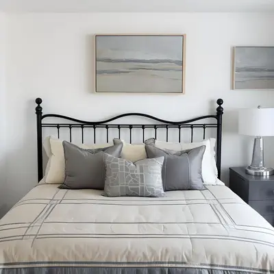 a bedroom with a large bed with pillows at RIVERSIDE STAY in Niagara Falls