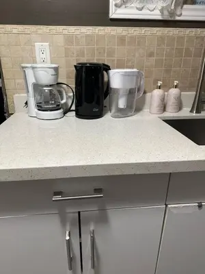 a kitchen counter with two appliances on a counter top at Cozy Private Basement Suite Beside Plaza Free Parking Walk to Groceries & Dining in Richmond Hill