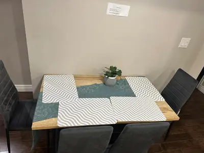 a table with a potted plant on top of it at Cozy and comfy 2 Bed rooms in Mississauga