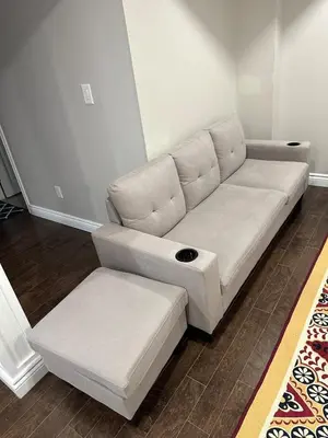 a white couch sitting in a living room at Cozy and comfy 2 Bed rooms in Mississauga