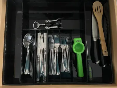 a black container filled with utensils at Bright & Cozy Basement Retreat in Oshawa