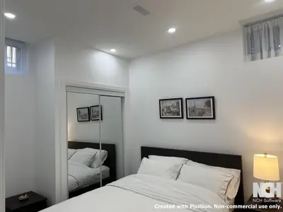 a white bedroom with a mirror and a bed at Modern 2-Bedroom Apartment in Luxury Home with Gym in Richmond Hill