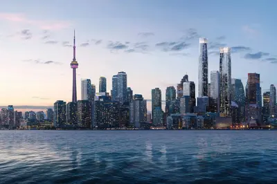 a city skyline with the cn tower and the water at Le Méridien Toronto Pinnacle Hotel in Toronto