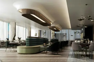 a restaurant with a couch and tables and chairs at Le Méridien Toronto Pinnacle Hotel in Toronto