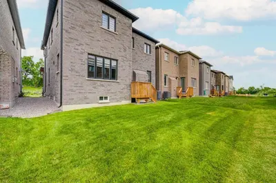 an empty yard in front of a brick building at Modern Spacious Luxury detached-House new in RH in Richmond Hill