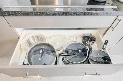 a drawer filled with pots and pans in a kitchen at Very Modern New Luxury House in RichmondHill in Richmond Hill