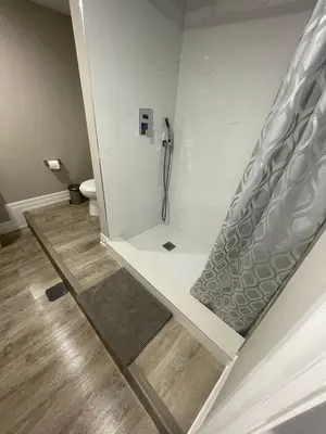 a bathroom with a walk in shower with a toilet at Sweet Home in Bloor Downtown-CENTRAL STAY in Toronto