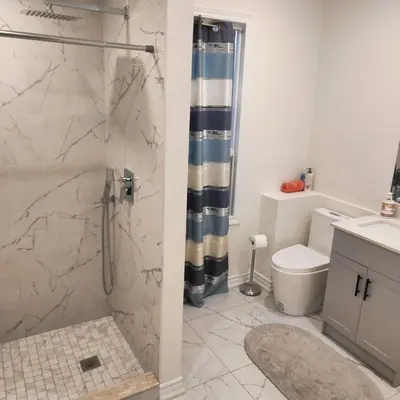 a bathroom with a shower and a toilet at Sweet Home in Bloor Downtown-CENTRAL STAY in Toronto