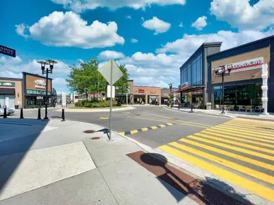 an empty city street with a crosswalk at Chic 2-Bedroom Apartment with Parking in Toronto