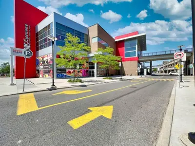 an empty street in front of a building at Chic 2-Bedroom Apartment with Parking in Toronto