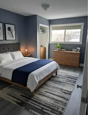 a bedroom with a large bed and a window at Family home in Hamilton