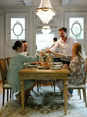 a group of people sitting around a dining room table at Guestroom in Old Town | Steps to Lake & Everything in Niagara on the Lake