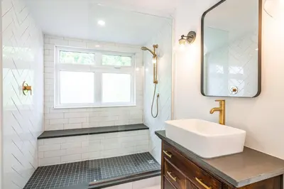 a bathroom with a sink and a mirror at Central Historic Cottage 4ppl in Heart of NOTL in Niagara on the Lake