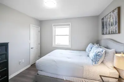 a bedroom with a bed and a window at Single Level Vineyard Home | 6 PPL | Pet Friendly in Niagara on the Lake