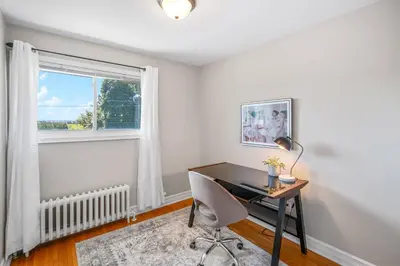 a home office with a desk and a window at Vineyard Home Pet Friendly NOTL Large Backyard in Niagara on the Lake