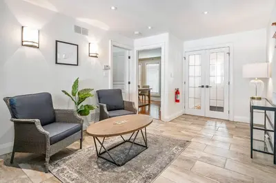a living room with two chairs and a table at Peaceful 3Bdrm Spacious NOTL Home mins to Town in Niagara on the Lake