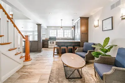 a living room with a couch and a table at Peaceful 3Bdrm Spacious NOTL Home mins to Town in Niagara on the Lake