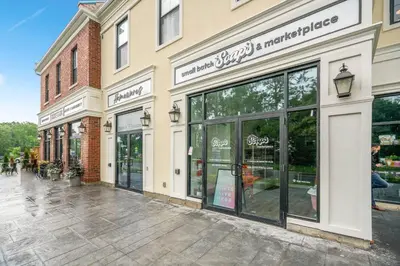 a store front of a building with large windows at 2 Bdrm Brand New Luxe Niagara Apt - up to 6ppl in Niagara on the Lake