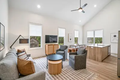 a living room with a couch and chairs at 2 Bdrm New Stylish Apt for up to 6 ppl in Niagara in Niagara on the Lake