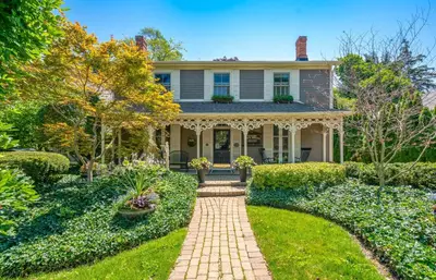 a house with a brick walkway in the yard at Hot Tub | Mini Putt | Historic Old Town | 2 Guests in Niagara on the Lake
