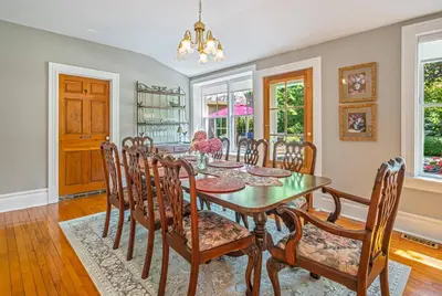 a dining room with a table and chairs at Hot Tub | Historic Home | Steps to Everything NOTL in Niagara on the Lake