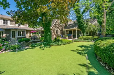a home with a yard of green grass at Hot Tub | Heart of Old Town NOTL | 2 Guests in Niagara on the Lake