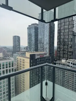 a view of a city from the top of a building at Lush 3 Bedroom Condo by CN Tower - Free Parking in Toronto