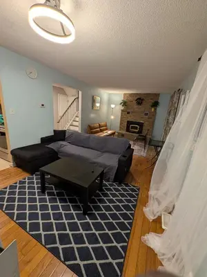 a living room with a couch and a table at Cozy Belleville Retreat Near DT & Waterfront in Belleville