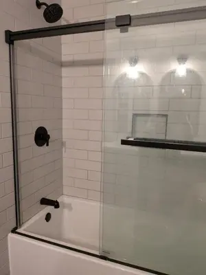 a shower with a glass door in a bathroom at Cozy Belleville Retreat Near DT & Waterfront in Belleville