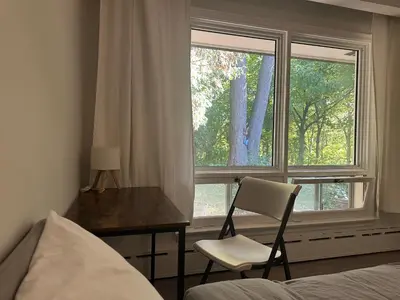 a bedroom with a desk and a chair and a window at Modern Private Room with Bessarion Subway North York in Toronto