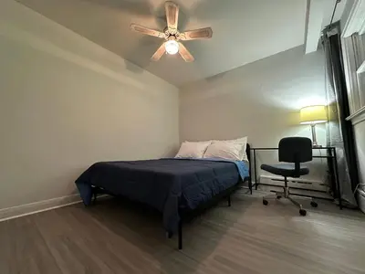 a bedroom with a bed and a ceiling fan at Modern Private Room with Bessarion Subway North York in Toronto