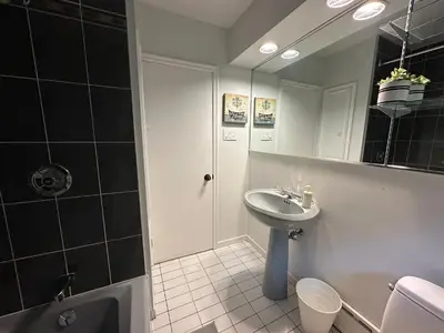a bathroom with a sink and a shower and a toilet at Modern Private Room with Bessarion Subway North York in Toronto