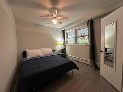 a bedroom with a bed and a ceiling fan at Modern Private Room with Bessarion Subway North York in Toronto