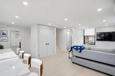 a living room with a couch and a table at The Wynford Dreamy Capri Suite in Elora