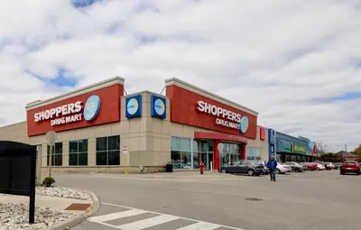 a store front of a shopping center with cars parked at Charming Mississauga Getaway in Mississauga
