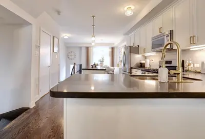 a kitchen with a sink and a counter top at Charming Mississauga Getaway in Mississauga