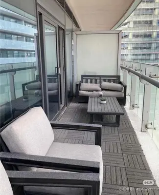 a balcony with couches and a table on a building at xto in Markham