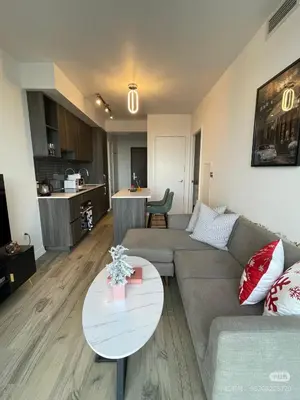 a living room with a couch and a table at xto in Markham