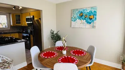 a kitchen with a table with red plates on it at 4-Bed, 3 bath Luxury Home in Oakville - Prime location in Oakville
