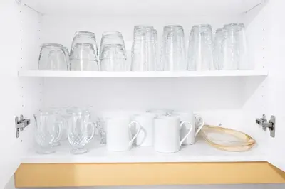 a shelf filled with glasses and other glass items at 4-Bed, 3 bath Luxury Home in Oakville - Prime location in Oakville