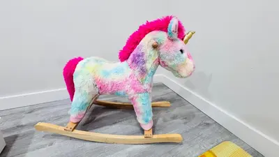 a stuffed unicorn toy on a wooden sled at 4-Bed, 3 bath Luxury Home in Oakville - Prime location in Oakville