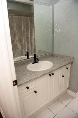 a bathroom with a sink and a mirror at Tranquil Haven near Niagara in Thorold