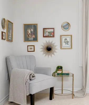 a living room with a chair and a table at Stylish and Cozy Muskoka Vacation Home in Gravenhurst